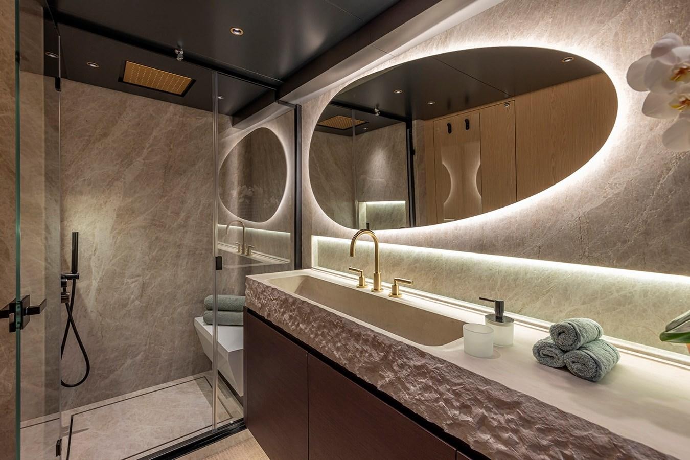 a bathroom with a large mirror aboard ARCADIA 96 Yacht for Sale