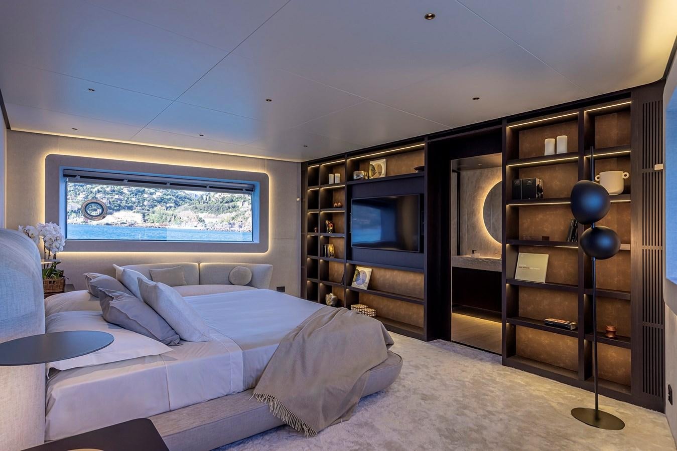 a room with a bed and a tv aboard ARCADIA 96 Yacht for Sale