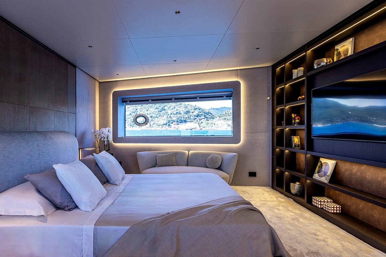 a bedroom with a large tv aboard ARCADIA 96 Yacht for Sale