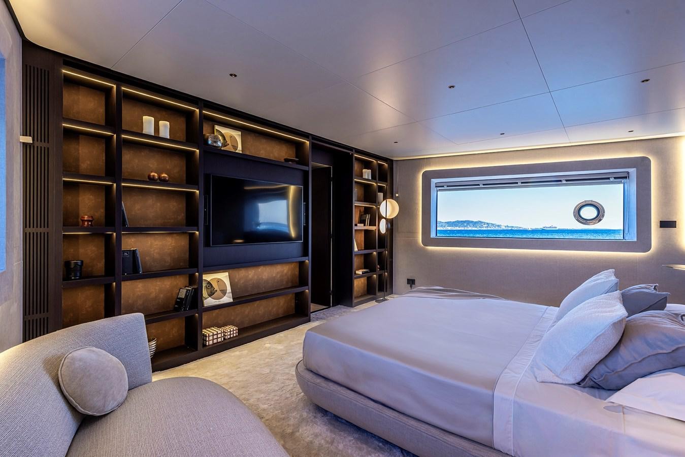 a room with a bed and a tv aboard ARCADIA 96 Yacht for Sale