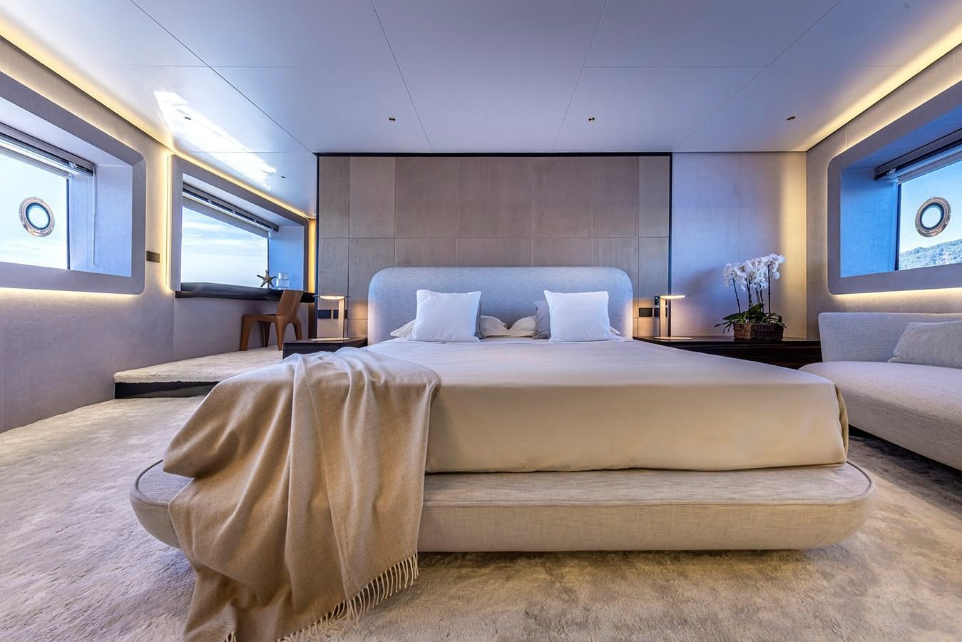 a room with a bed and a couch aboard ARCADIA 96 Yacht for Sale