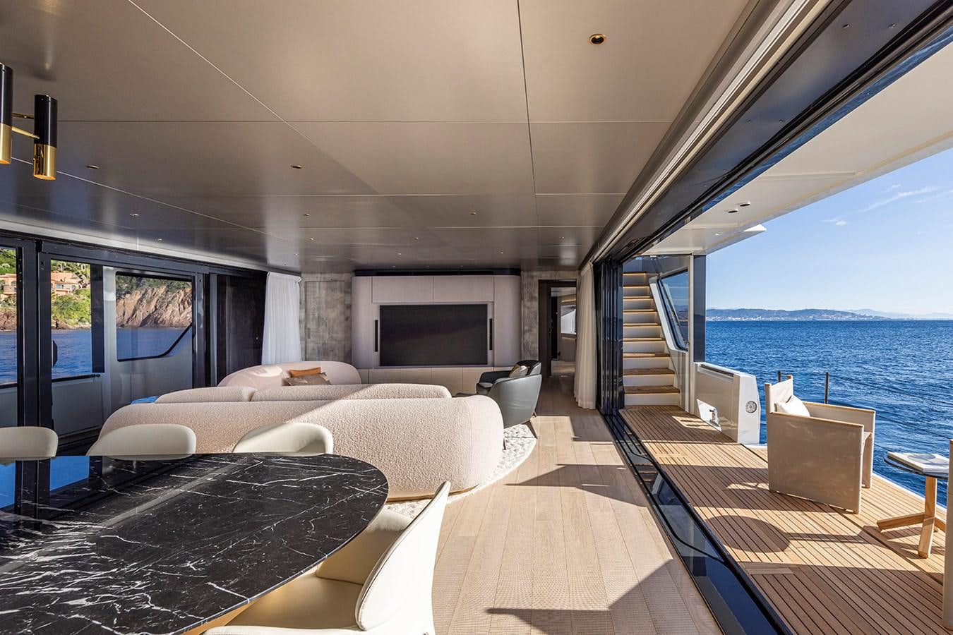 a living room with a large balcony aboard ARCADIA 96 Yacht for Sale