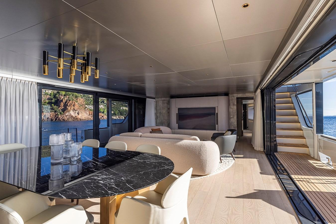 a living room with a large window aboard ARCADIA 96 Yacht for Sale