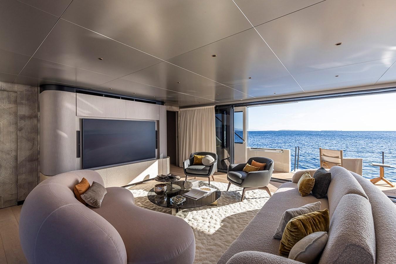 a living room with a large window aboard ARCADIA 96 Yacht for Sale
