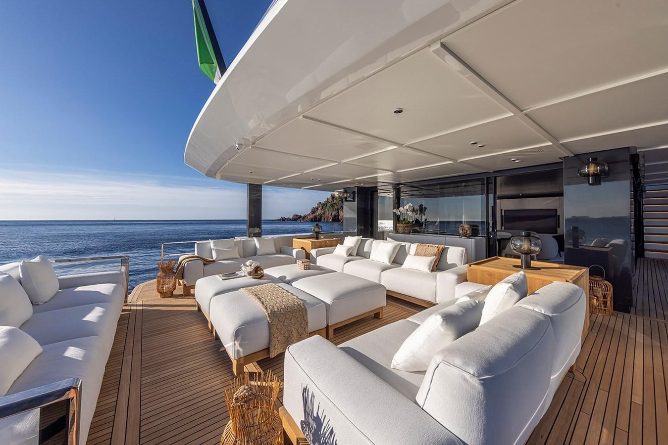 a room with a bed and a large window aboard ARCADIA 96 Yacht for Sale