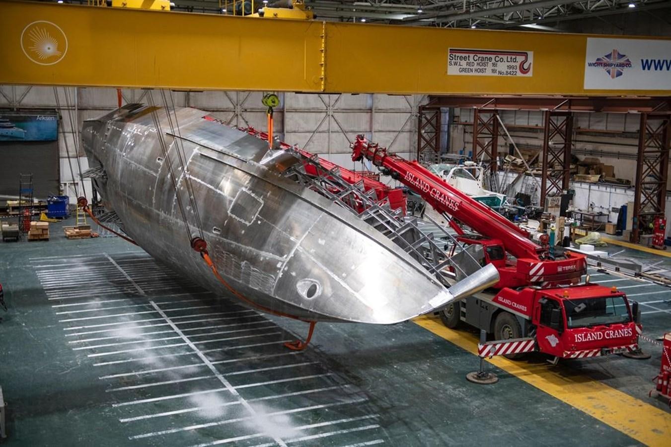 a large metal object with a red car on it aboard 2024 ARKSEN 85 Yacht for Sale