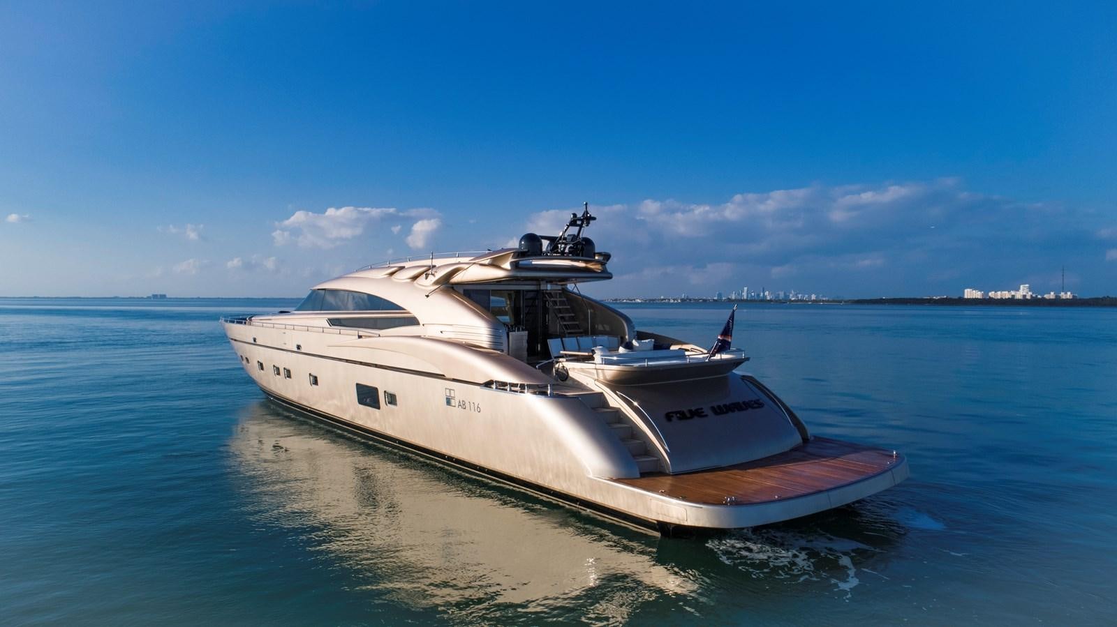 a white boat on the water aboard FIVE WAVES Yacht for Sale