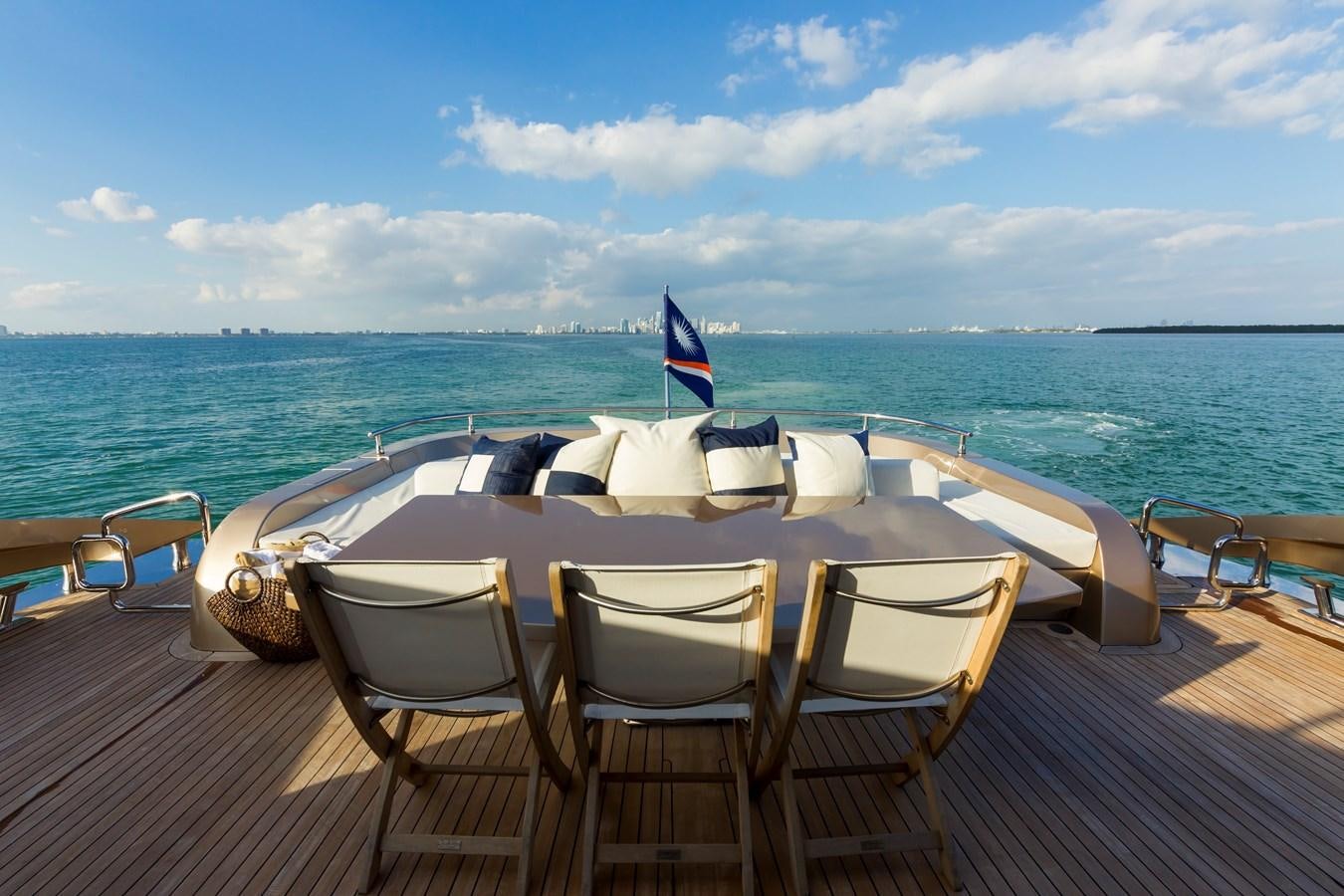 a table set for a meal on a beach aboard FIVE WAVES Yacht for Sale