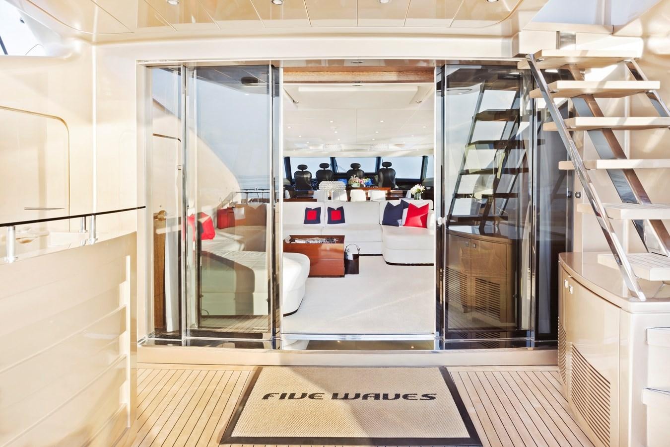 a room with a glass door and a staircase aboard FIVE WAVES Yacht for Sale