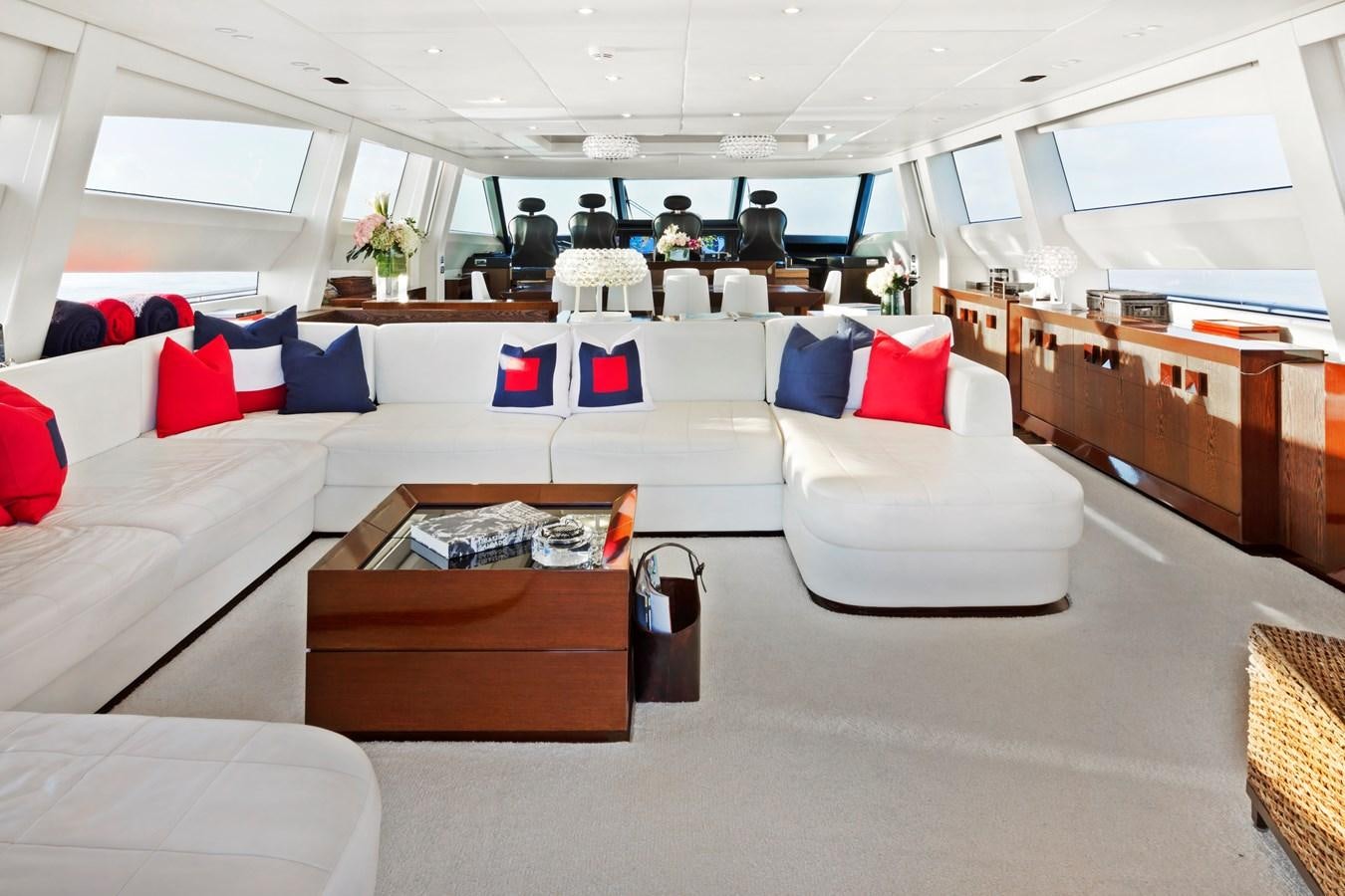 a large room with a couch and a coffee table aboard FIVE WAVES Yacht for Sale