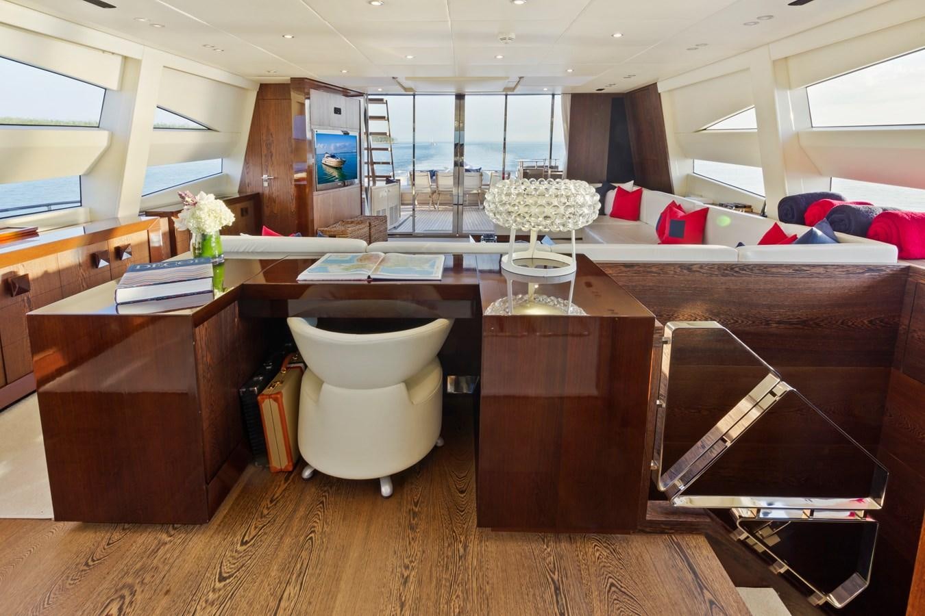 a room with a desk and a bed aboard FIVE WAVES Yacht for Sale