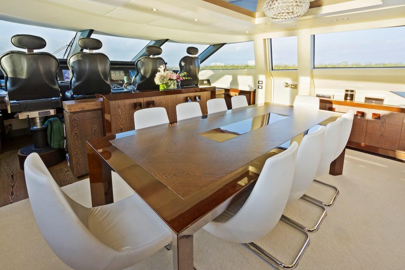 a room with a table and chairs aboard FIVE WAVES Yacht for Sale