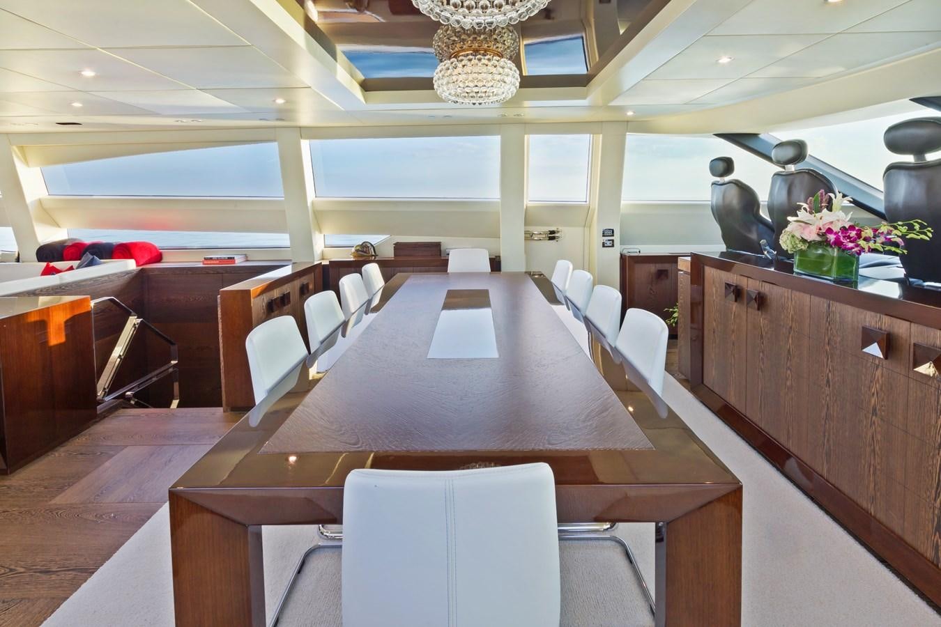 a large room with tables and chairs aboard FIVE WAVES Yacht for Sale