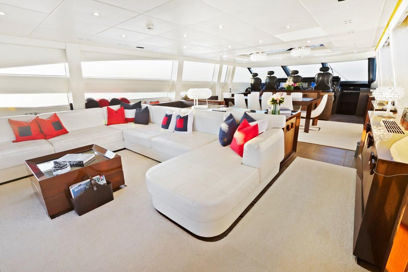 a large room with couches and tables aboard FIVE WAVES Yacht for Sale