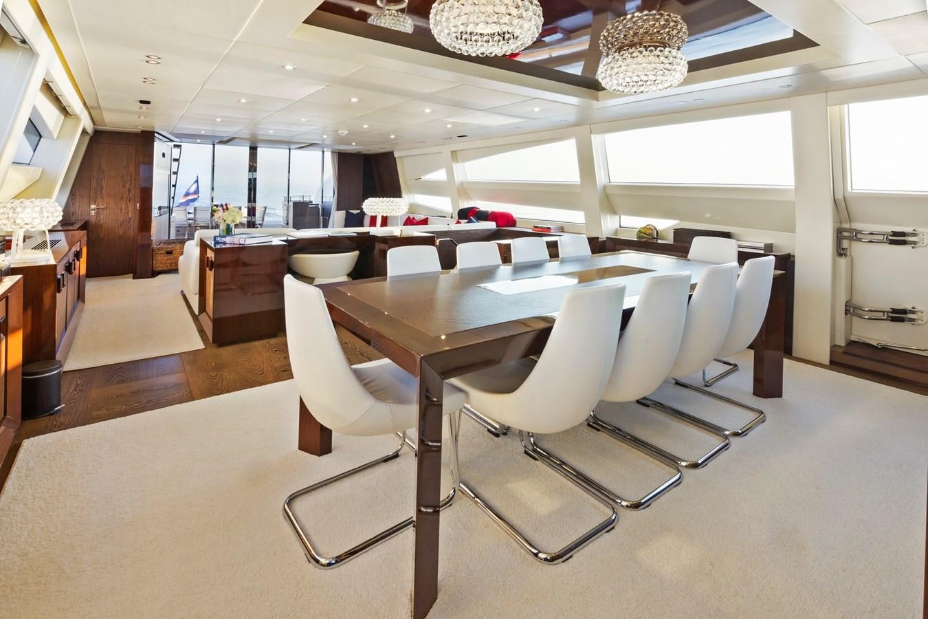 a room with chairs and tables aboard FIVE WAVES Yacht for Sale