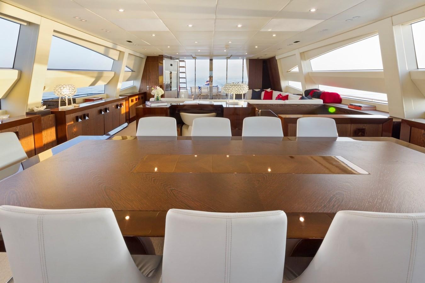 a room with a large table and chairs aboard FIVE WAVES Yacht for Sale