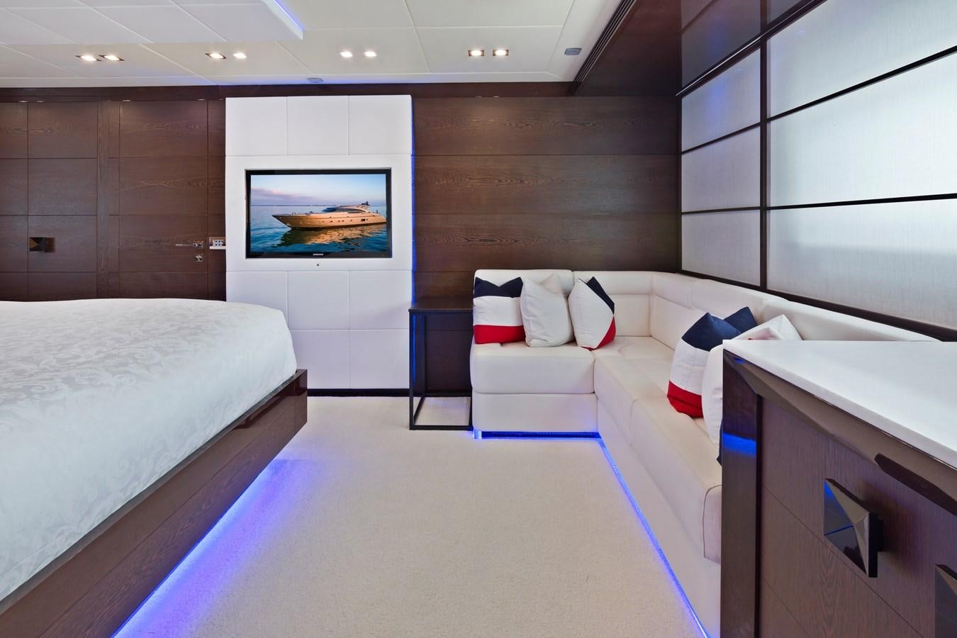 a room with a bed and a television aboard FIVE WAVES Yacht for Sale