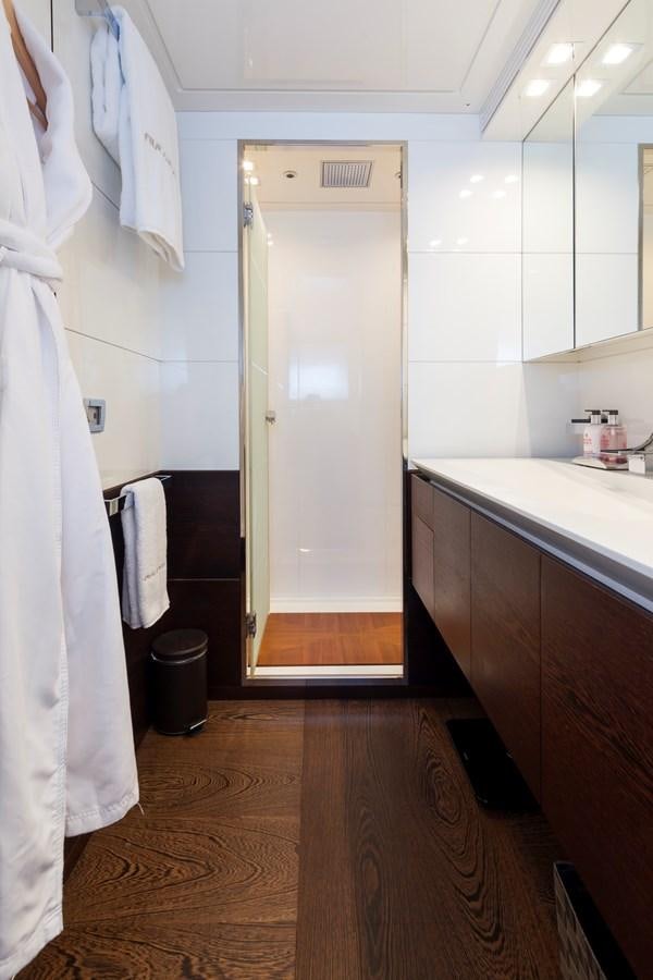 a bathroom with a shower unit and sink aboard FIVE WAVES Yacht for Sale