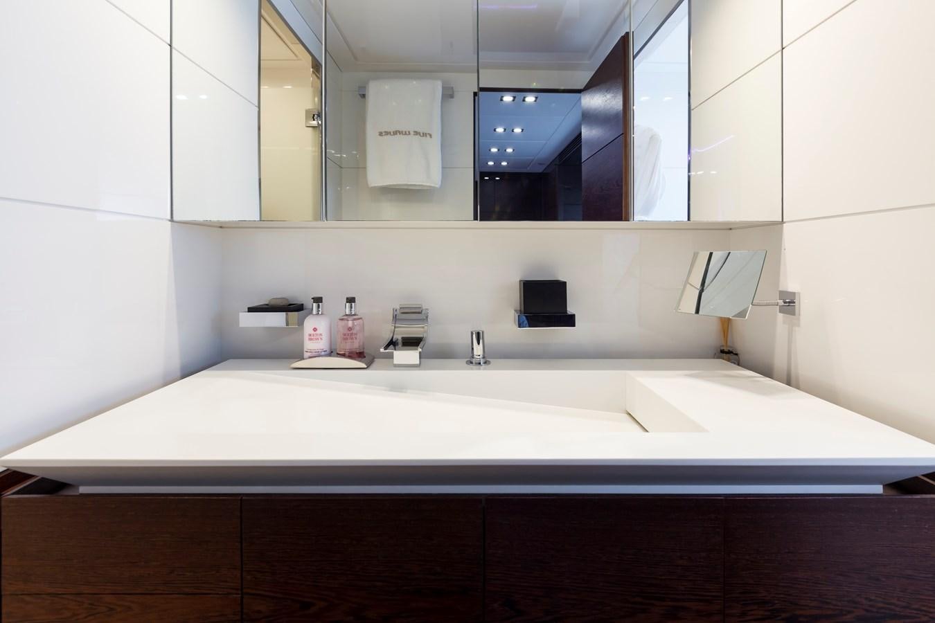 a bathroom with a large mirror aboard FIVE WAVES Yacht for Sale