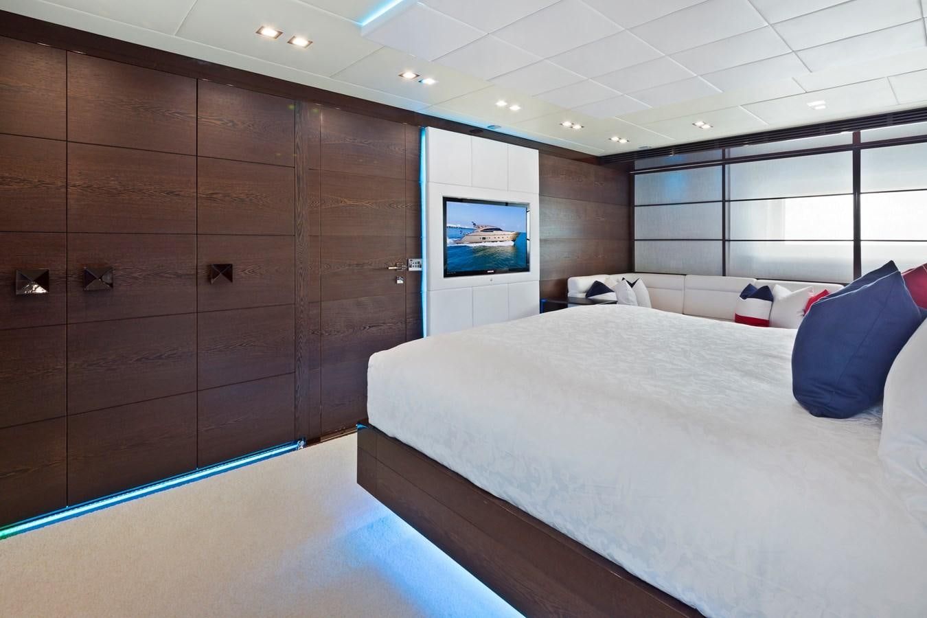 a room with a bed and a television aboard FIVE WAVES Yacht for Sale