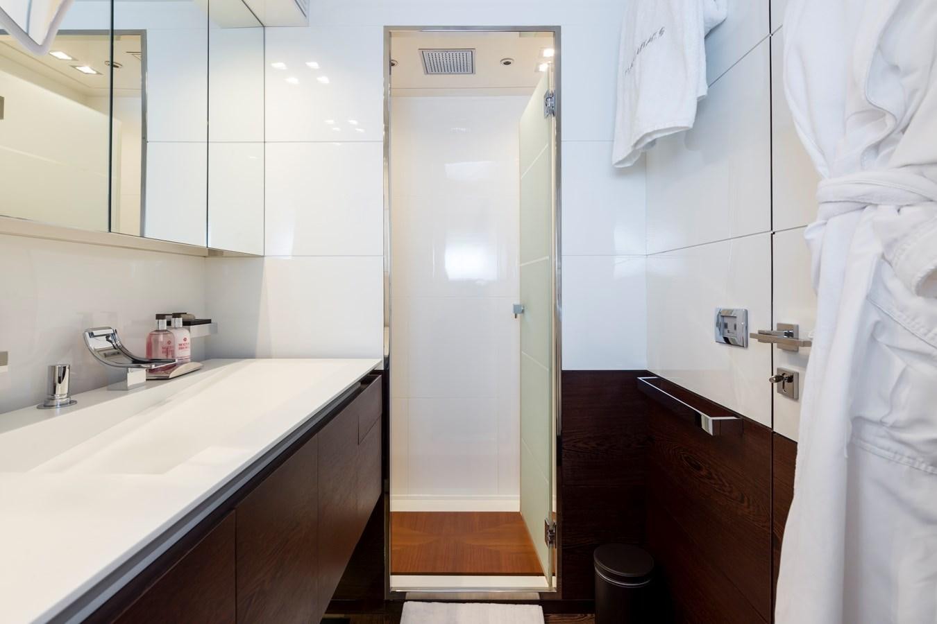 a bathroom with a sink and a mirror aboard FIVE WAVES Yacht for Sale