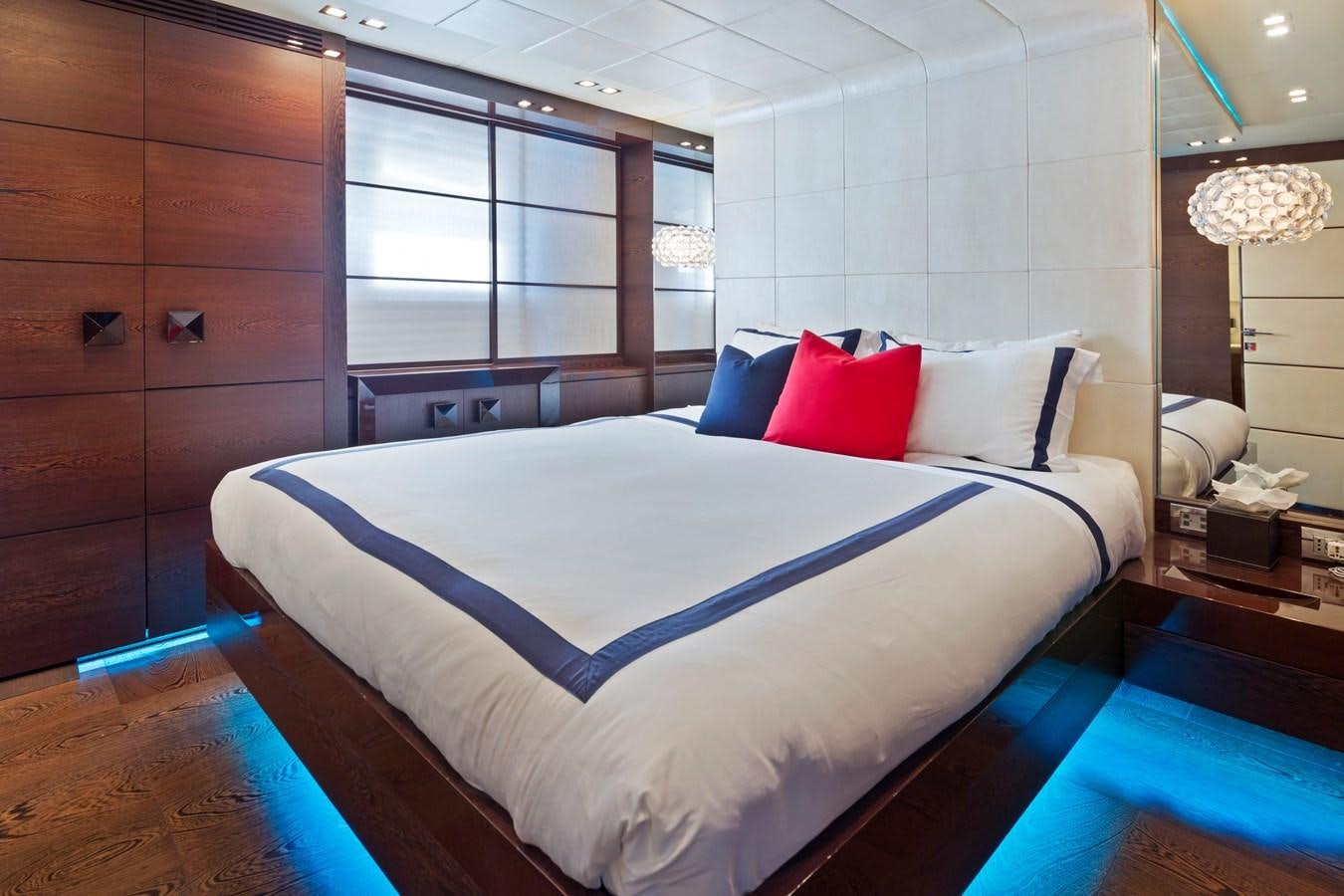 a large bed in a room aboard FIVE WAVES Yacht for Sale