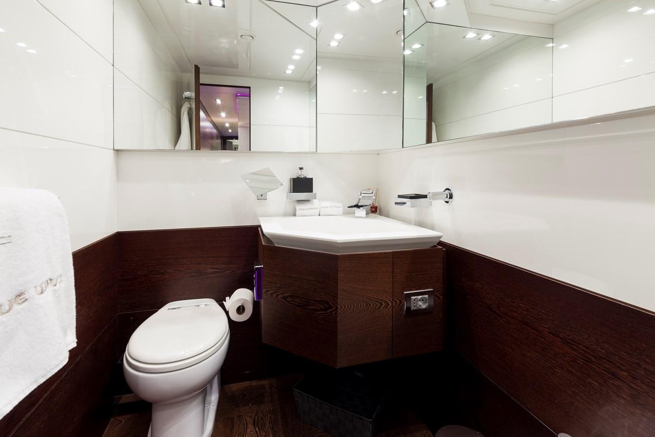a bathroom with a toilet and sink aboard FIVE WAVES Yacht for Sale