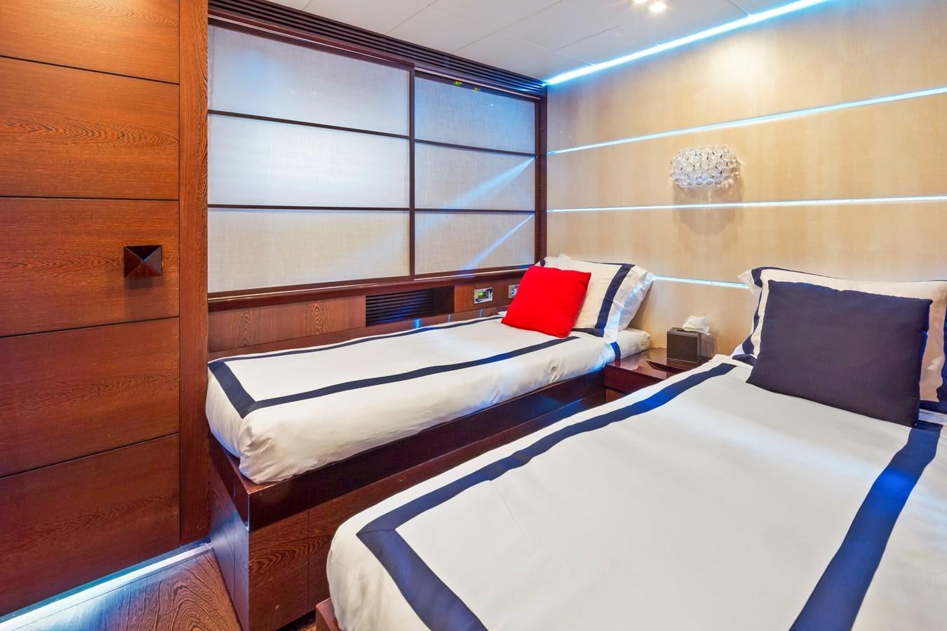 a room with two beds aboard FIVE WAVES Yacht for Sale