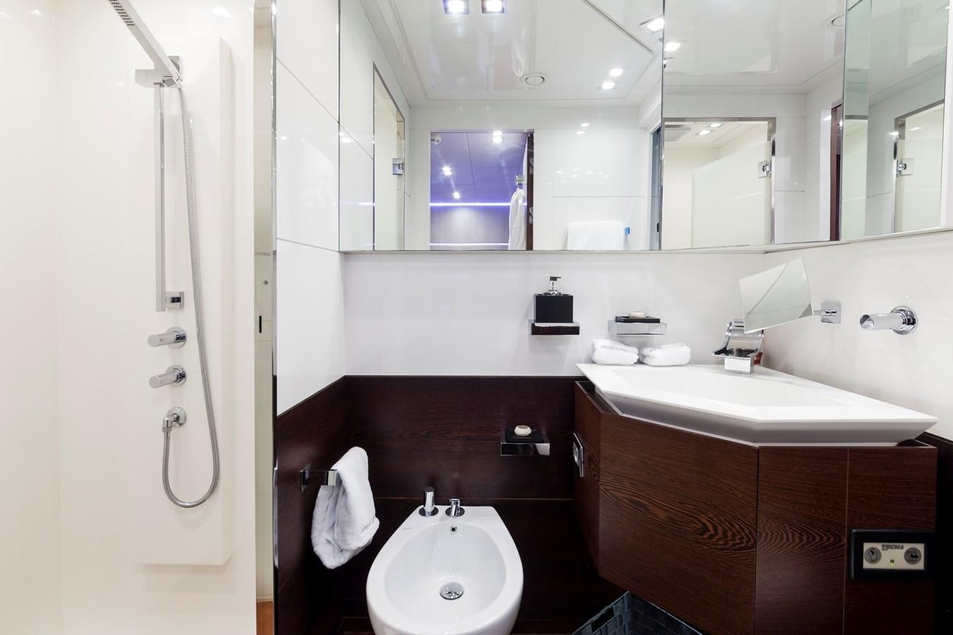 a bathroom with a sink and a mirror aboard FIVE WAVES Yacht for Sale