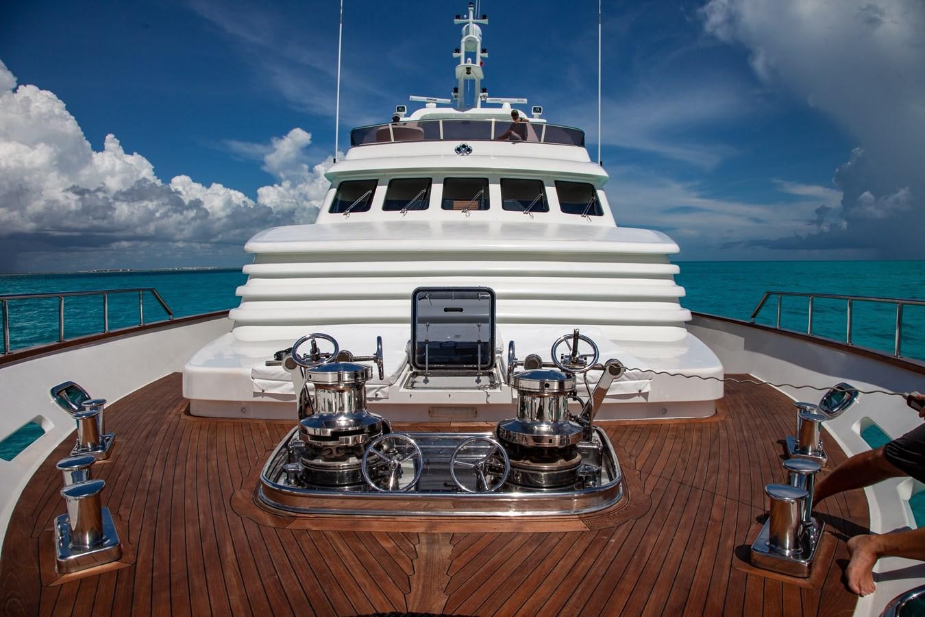 a white boat on a wooden surface aboard SUNRISE Yacht for Sale