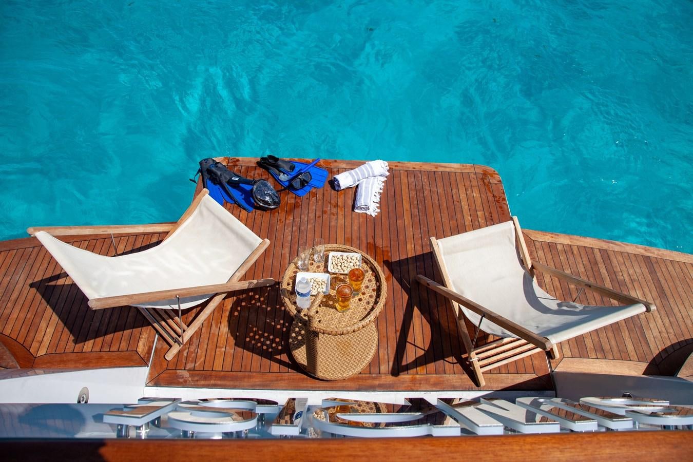a table with a book and headphones on it aboard SUNRISE Yacht for Sale