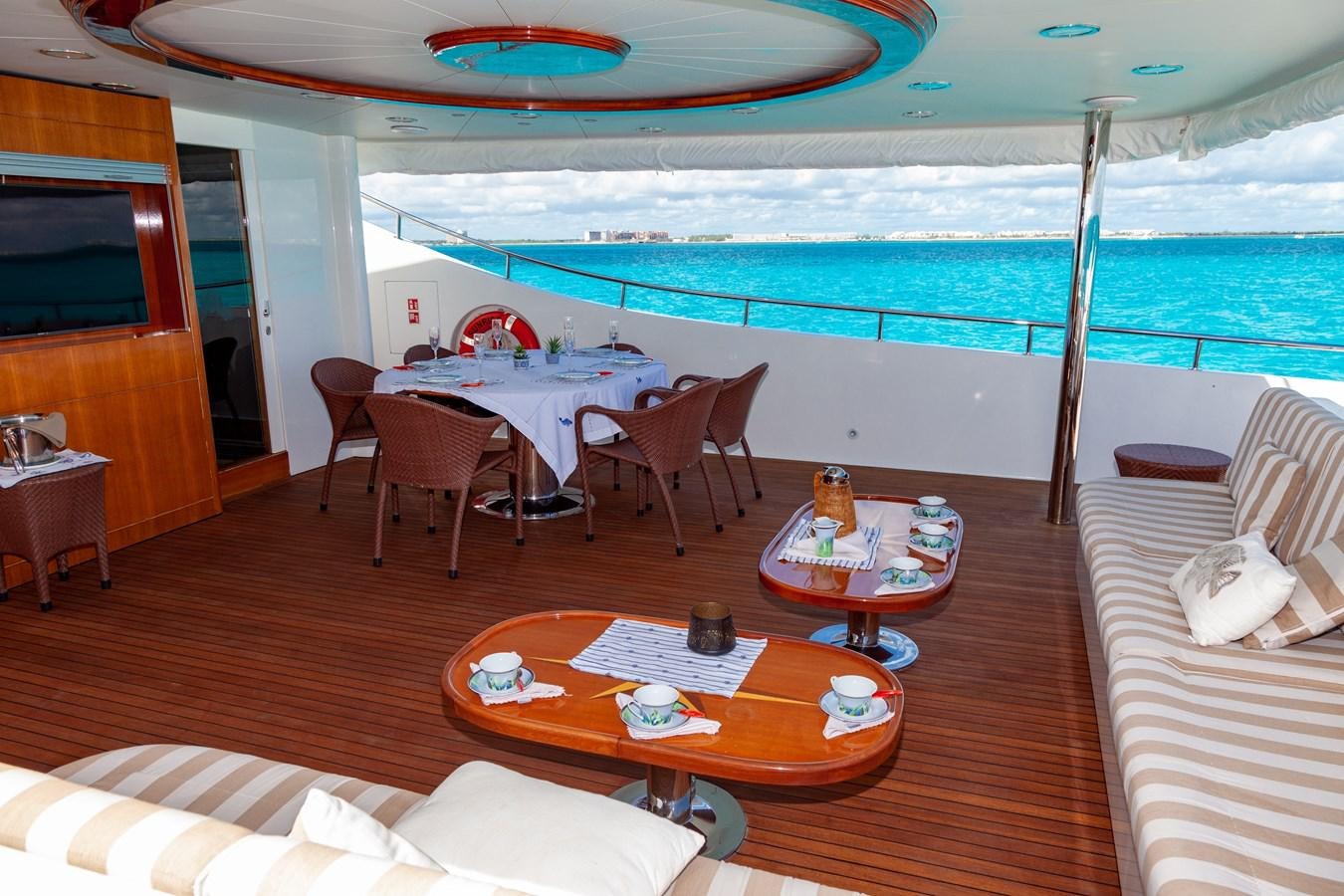 a room with a table and chairs aboard SUNRISE Yacht for Sale
