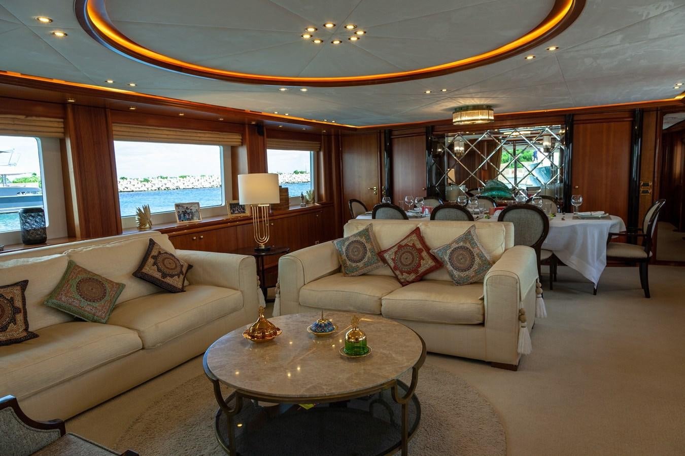 a living room with a couch and a table aboard SUNRISE Yacht for Sale