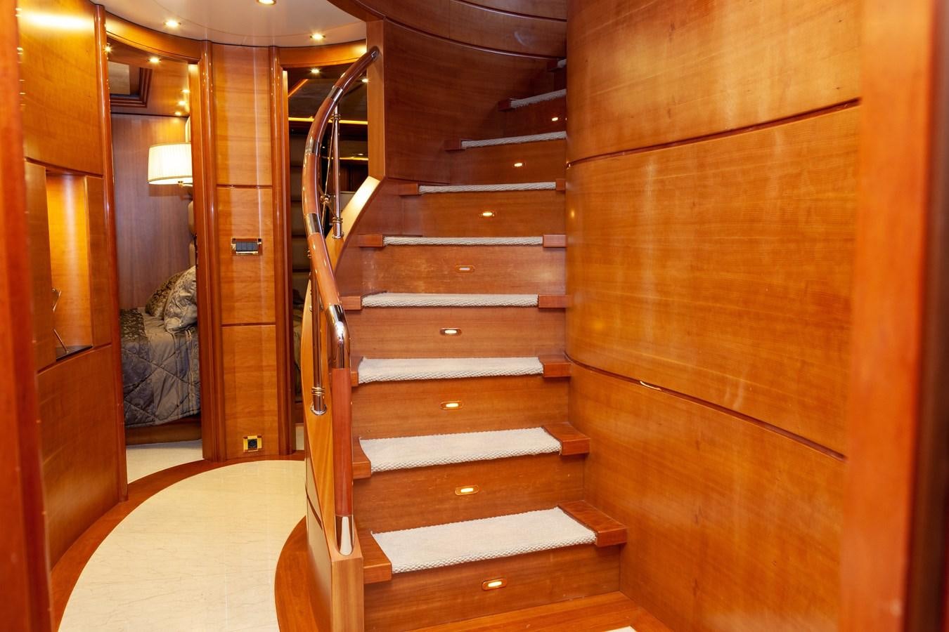 a wooden staircase in a room aboard SUNRISE Yacht for Sale