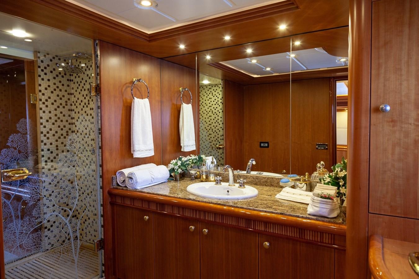 a bathroom with a large mirror aboard SUNRISE Yacht for Sale