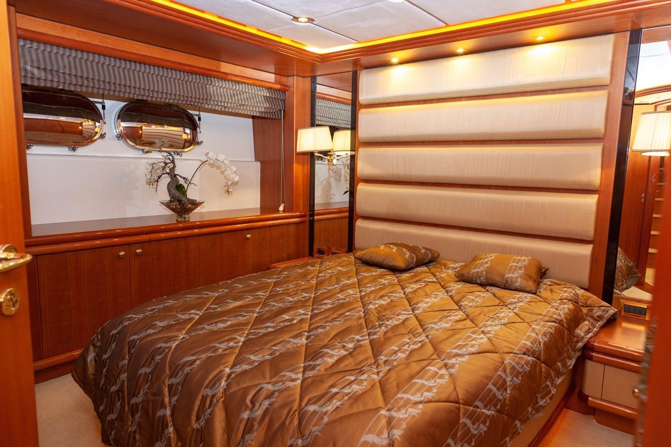 a bedroom with a large bed aboard SUNRISE Yacht for Sale