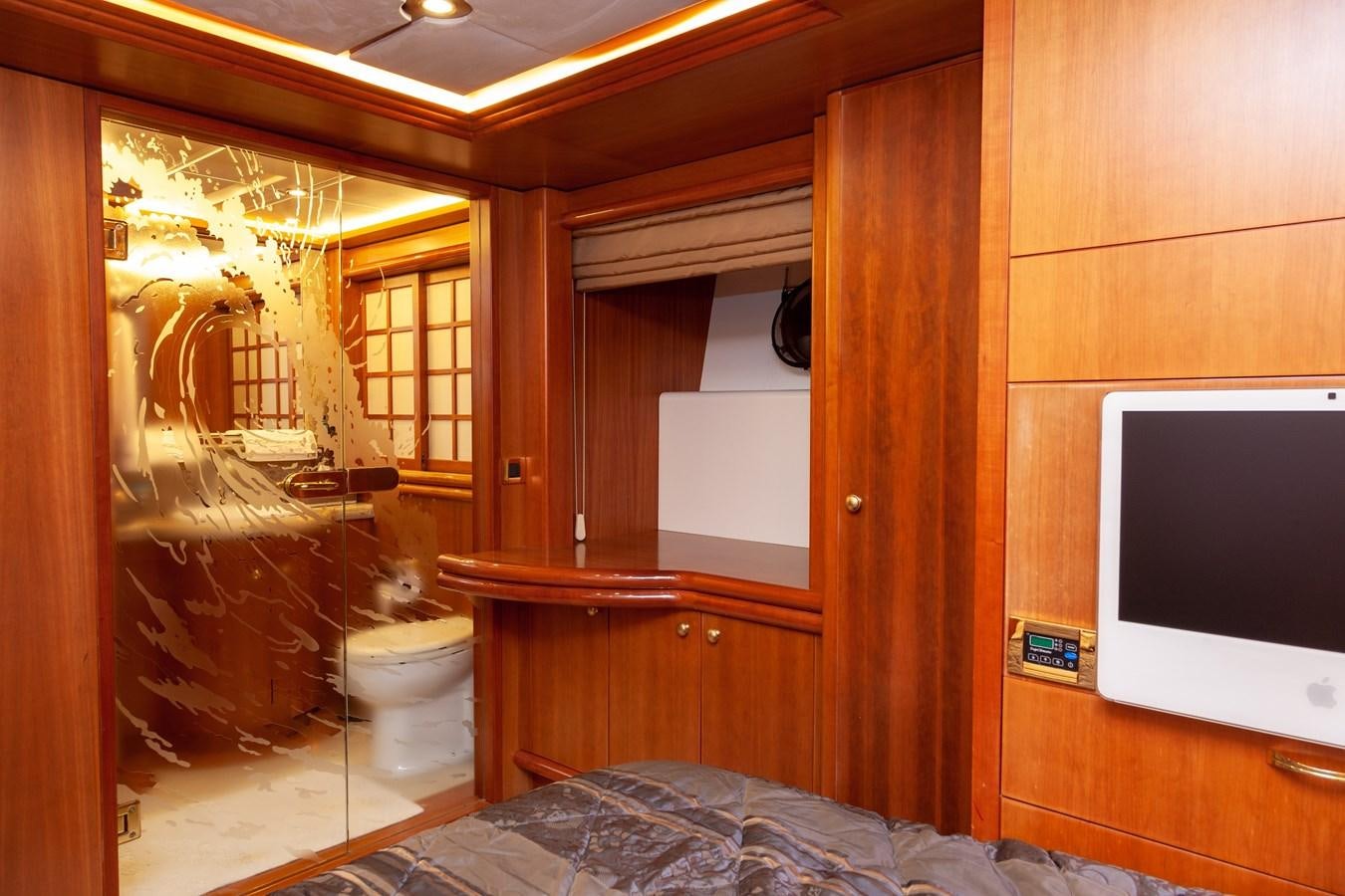 a bathroom with a bed and a television aboard SUNRISE Yacht for Sale