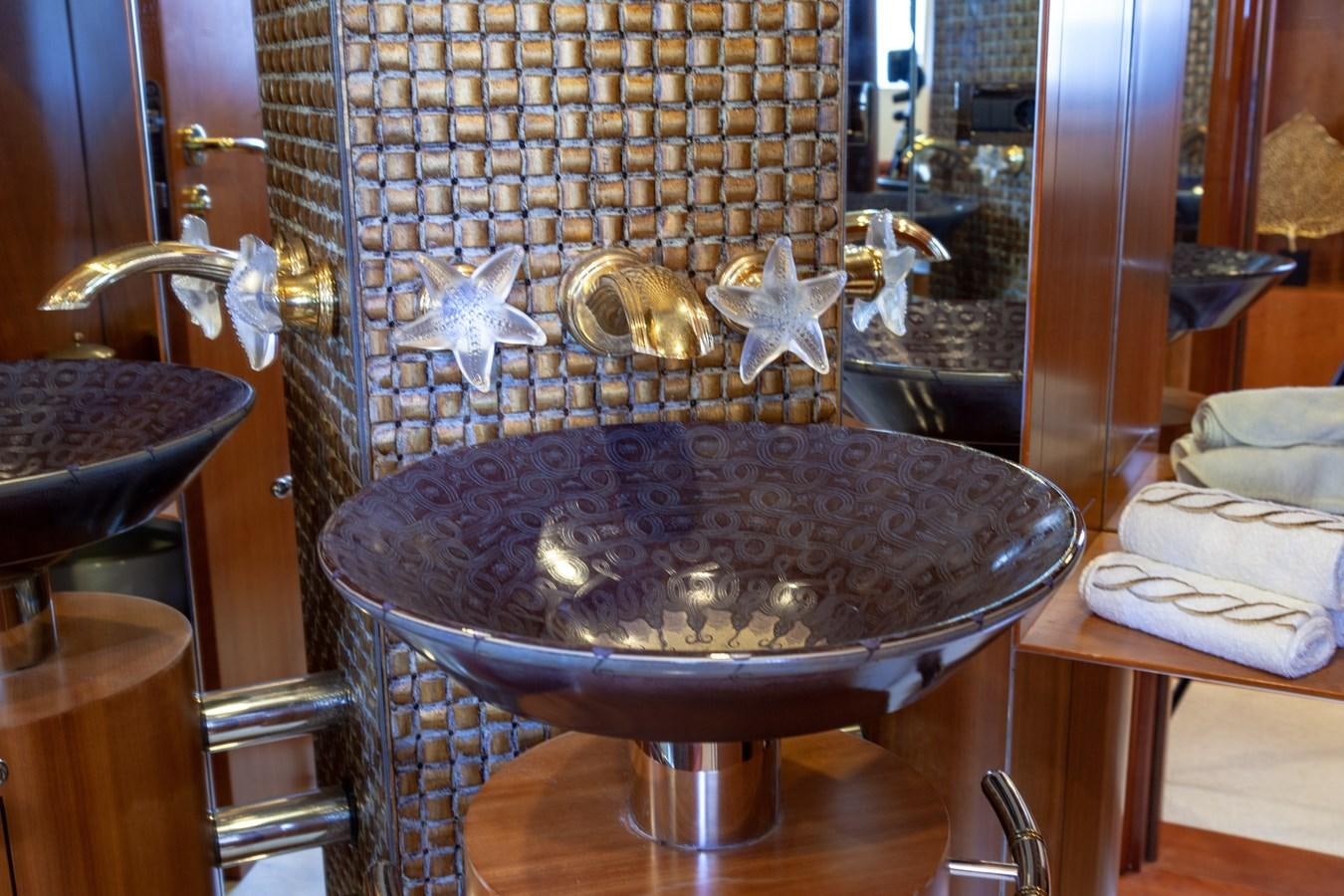 a bird in a glass cage aboard SUNRISE Yacht for Sale