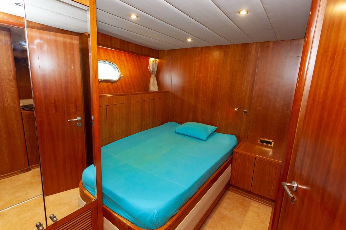 a bed in a room aboard SUNRISE Yacht for Sale