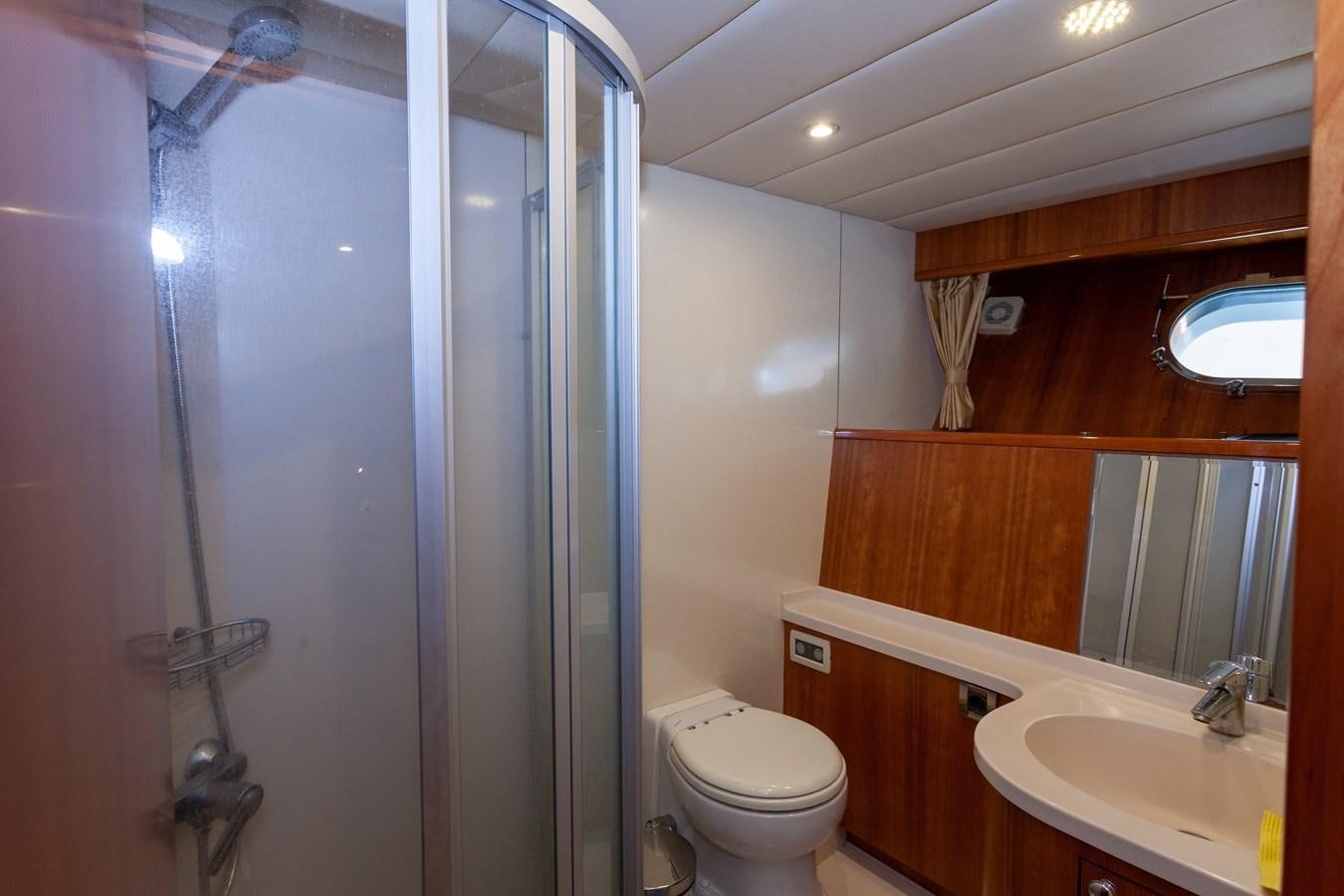 a bathroom with a shower and sink aboard SUNRISE Yacht for Sale