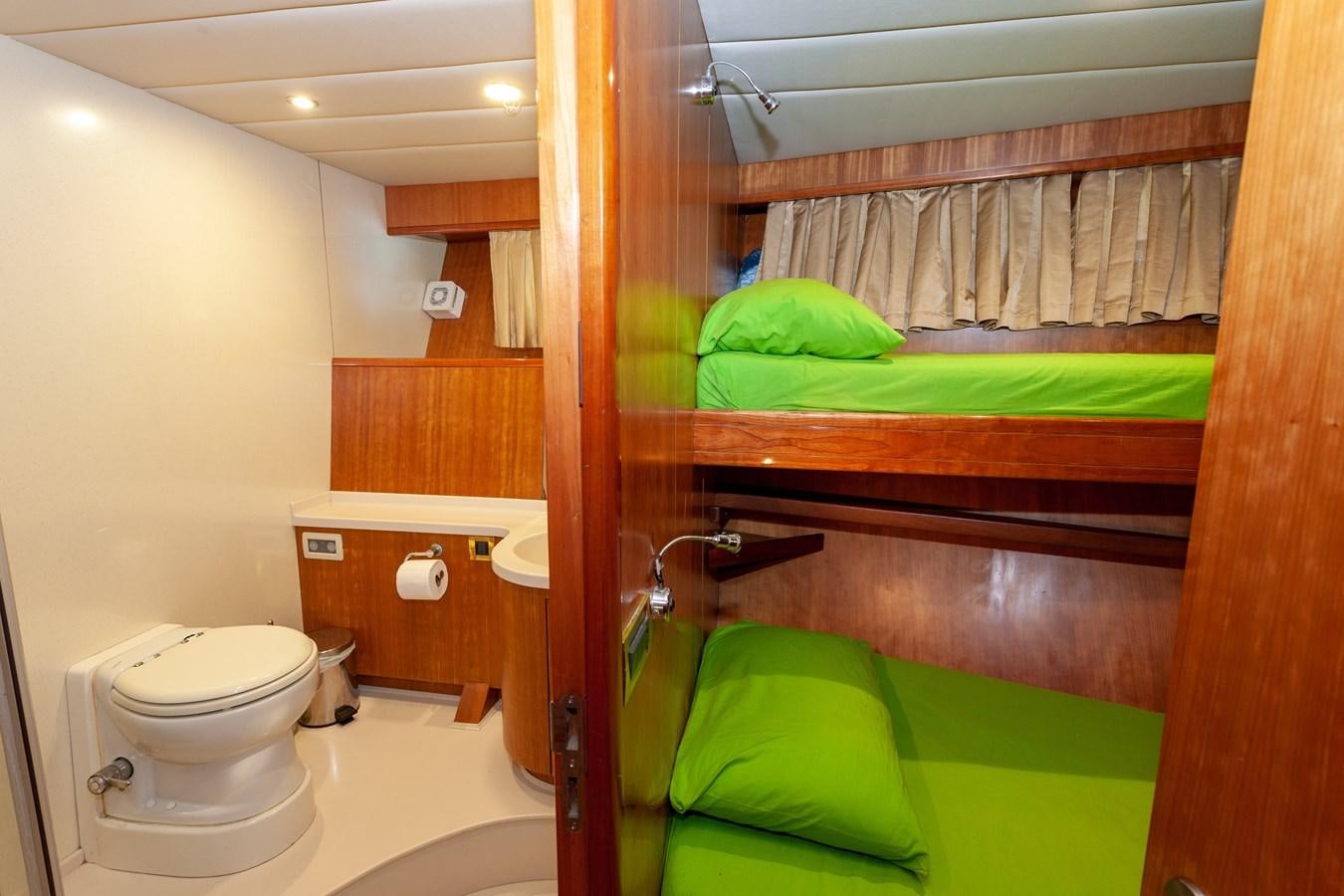 a bathroom with a toilet and a sink aboard SUNRISE Yacht for Sale