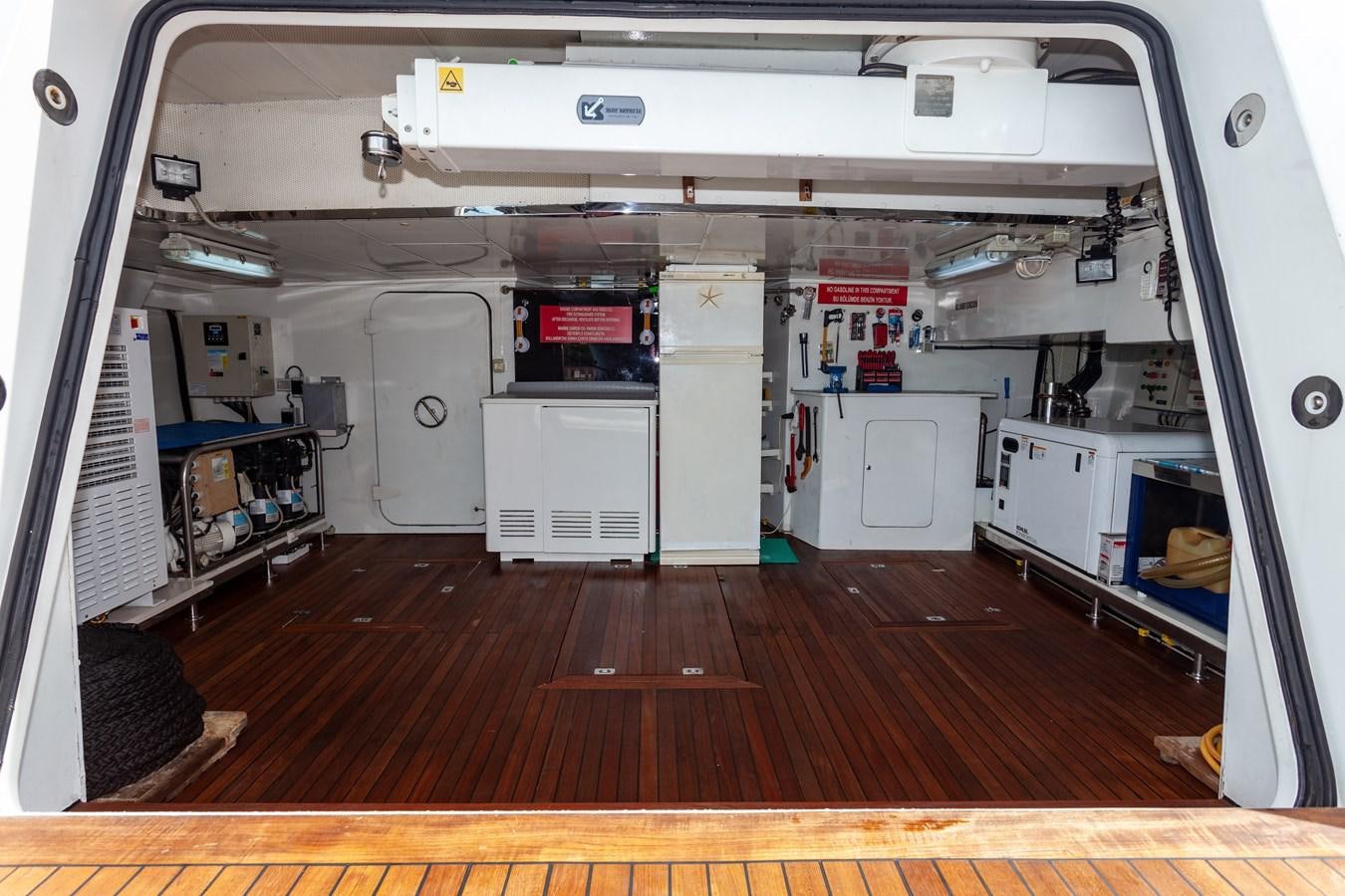 a room with a wood floor and a white cabinet and a white door aboard SUNRISE Yacht for Sale