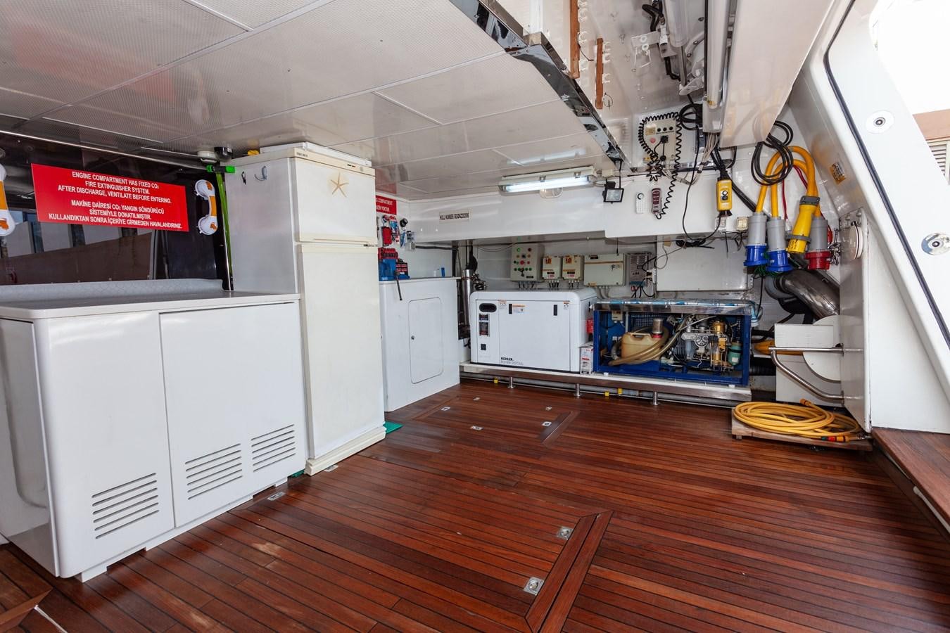 a large kitchen with white cabinets aboard SUNRISE Yacht for Sale