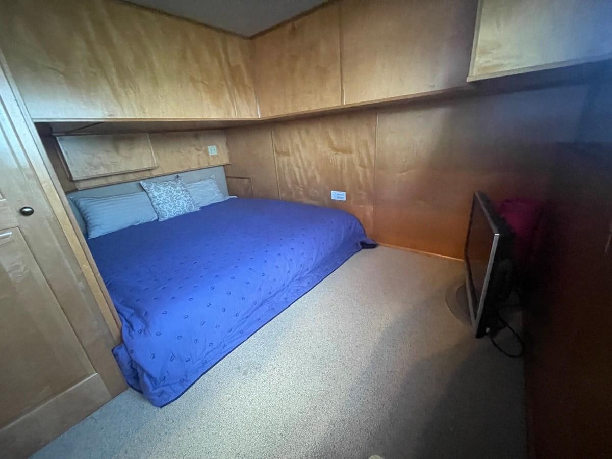 a bed in a room aboard 2005 HORIZON 18X88 HOUSEBOAT Yacht for Sale