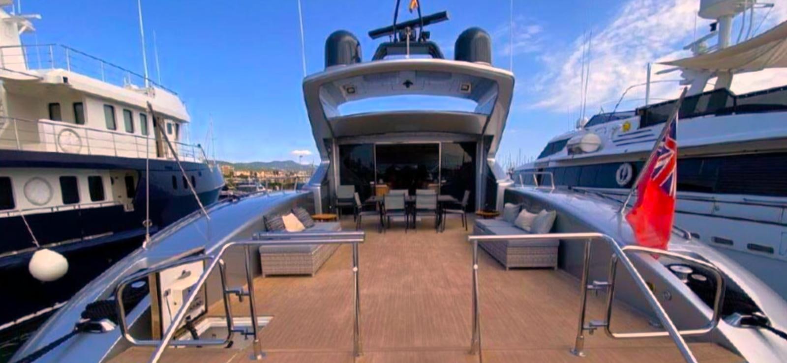 a boat docked at a pier aboard ESCAPE MANA Yacht for Sale