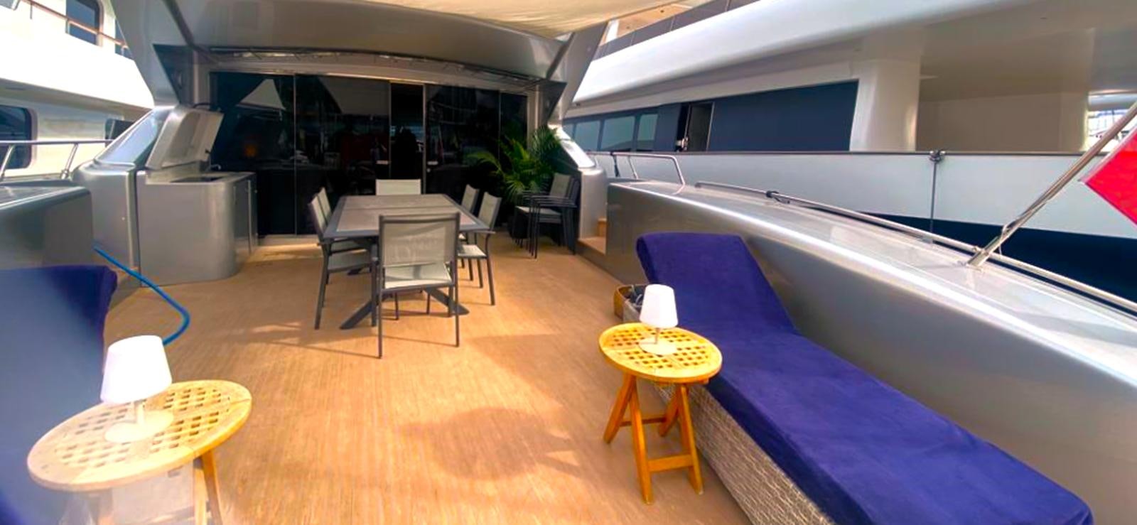 a pool table and chairs in a room with a table and chairs aboard ESCAPE MANA Yacht for Sale