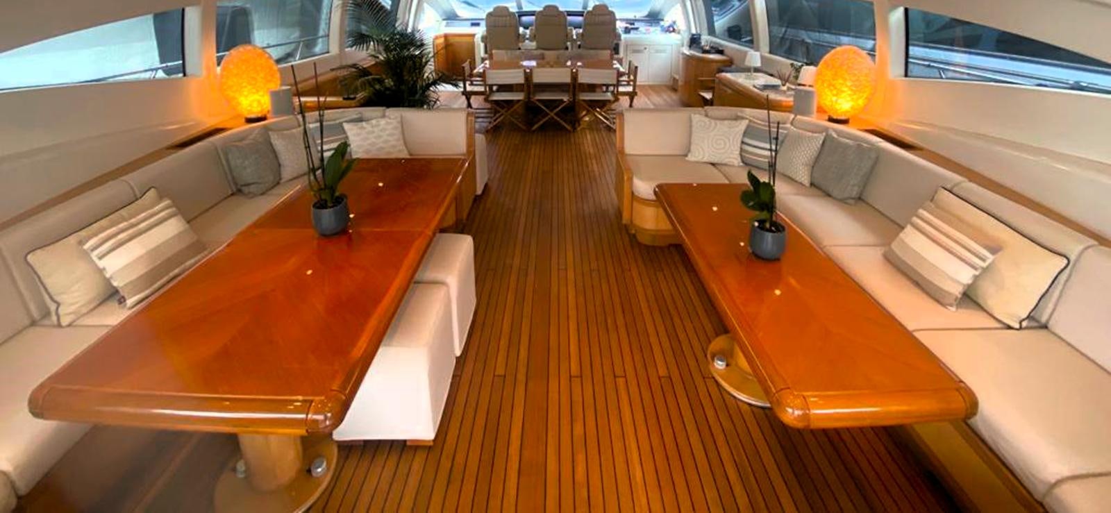 a room with a couch and a table and chairs aboard ESCAPE MANA Yacht for Sale