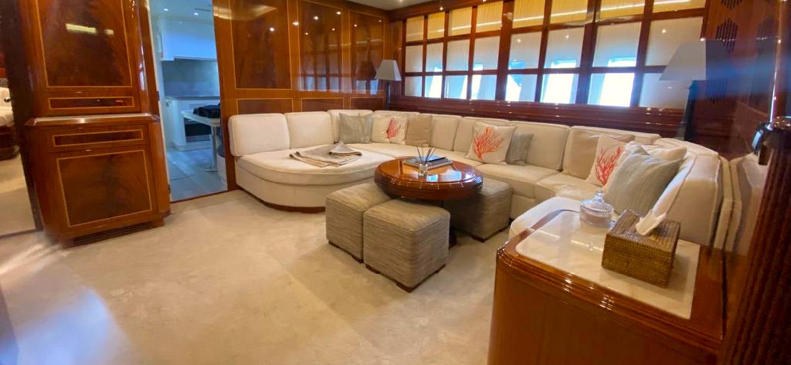 a living room with a couch and a coffee table aboard ESCAPE MANA Yacht for Sale