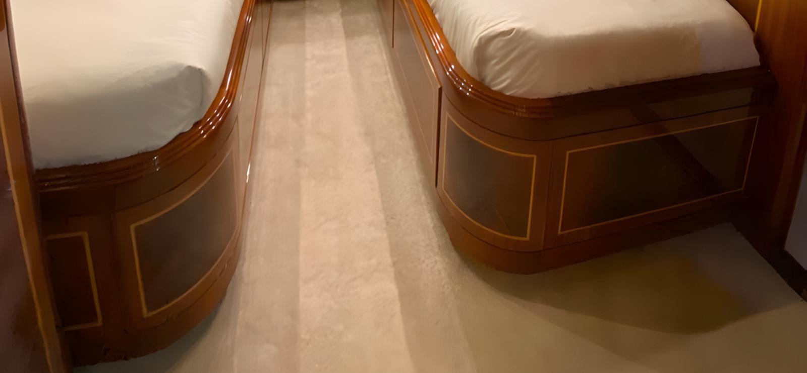 a wooden cabinet with a mirror aboard ESCAPE MANA Yacht for Sale