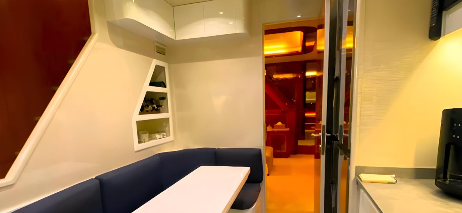 a room with a desk and a chair aboard ESCAPE MANA Yacht for Sale